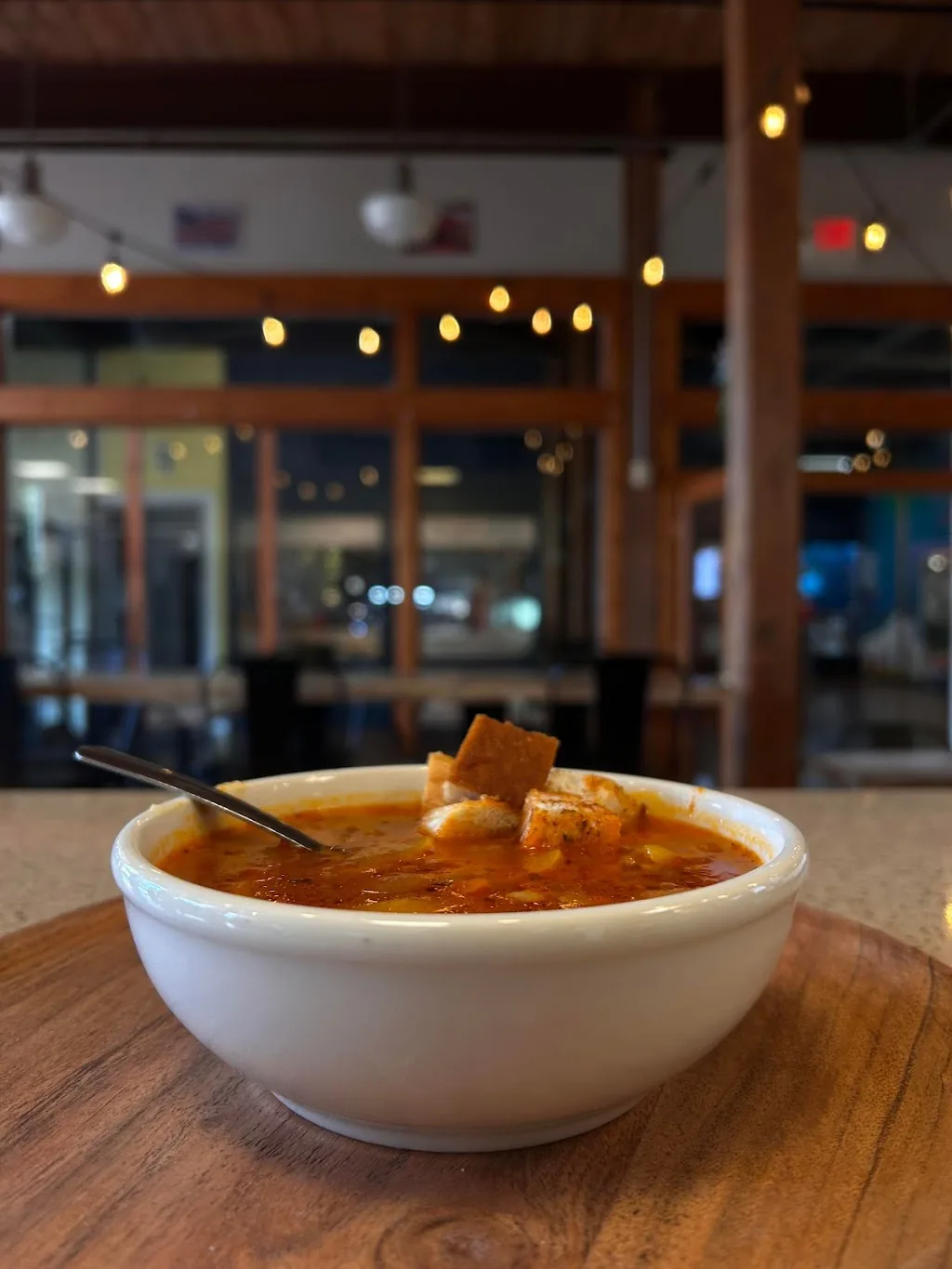 Tomato-based soup served with croutons